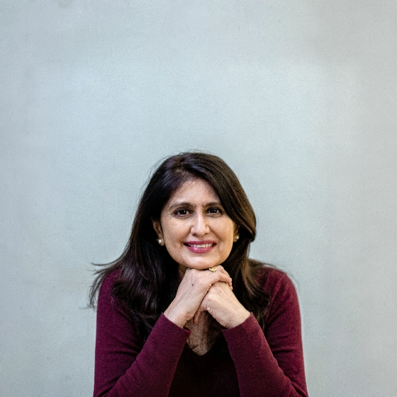 Payal Rajaratnam, Executive Coach, smiling in professional attire
